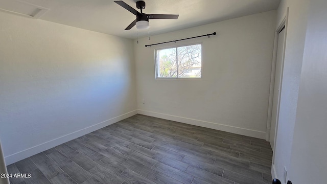 spare room with ceiling fan and hardwood / wood-style flooring