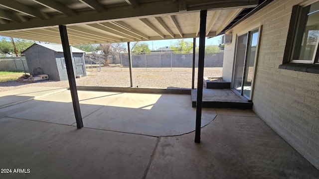 view of patio / terrace with an AC wall unit