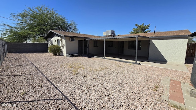 rear view of house featuring a patio and central air condition unit