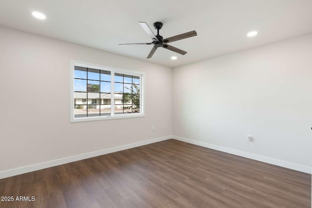 unfurnished room with dark wood-type flooring and ceiling fan