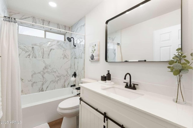 full bathroom with vanity, shower / bath combination with curtain, and toilet