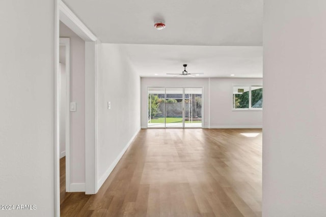 empty room featuring ceiling fan and light hardwood / wood-style flooring