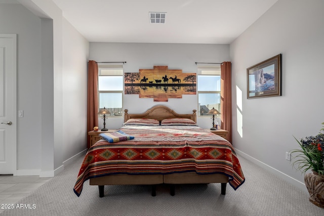 bedroom with light carpet, baseboards, and visible vents