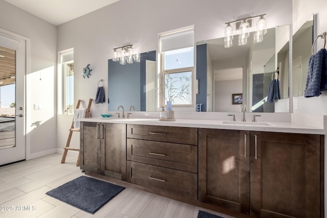 full bathroom with double vanity and a sink