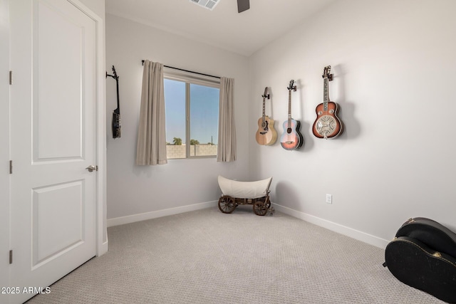 unfurnished room featuring carpet floors, baseboards, a ceiling fan, and visible vents