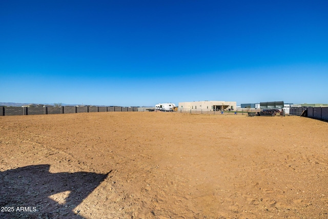 view of yard featuring fence and an enclosed area