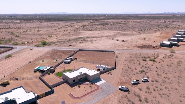 aerial view with a rural view, a mountain view, and a desert view