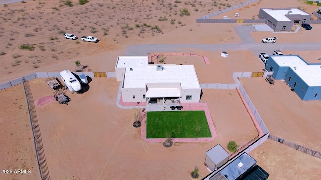 birds eye view of property featuring view of desert