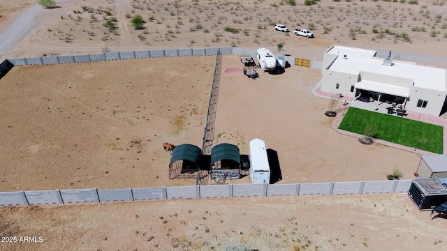 birds eye view of property featuring view of desert