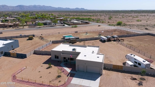 aerial view featuring a rural view, a mountain view, and a desert view