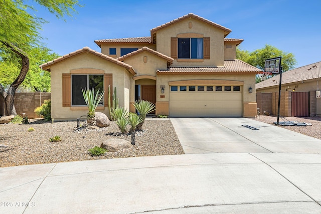 mediterranean / spanish-style house featuring stucco siding, fence, a tile roof, driveway, and an attached garage
