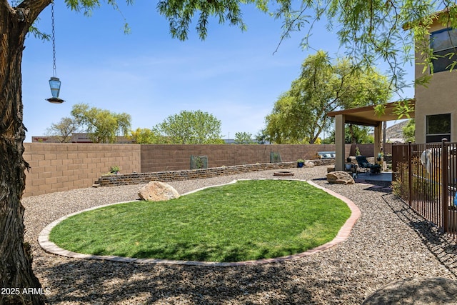 view of yard featuring a fenced backyard and a patio area