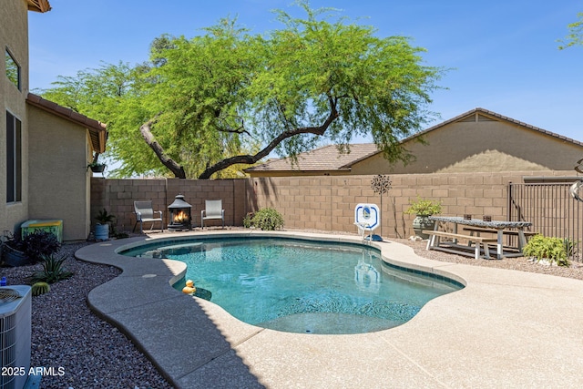 view of pool featuring a patio, a fenced backyard, central AC unit, and a fenced in pool