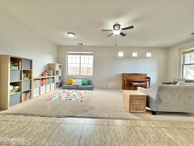 playroom with ceiling fan and carpet flooring