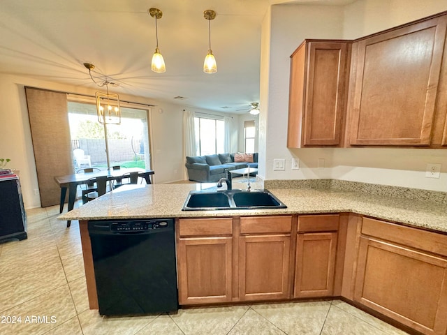 kitchen with light tile patterned flooring, ceiling fan with notable chandelier, black dishwasher, sink, and hanging light fixtures