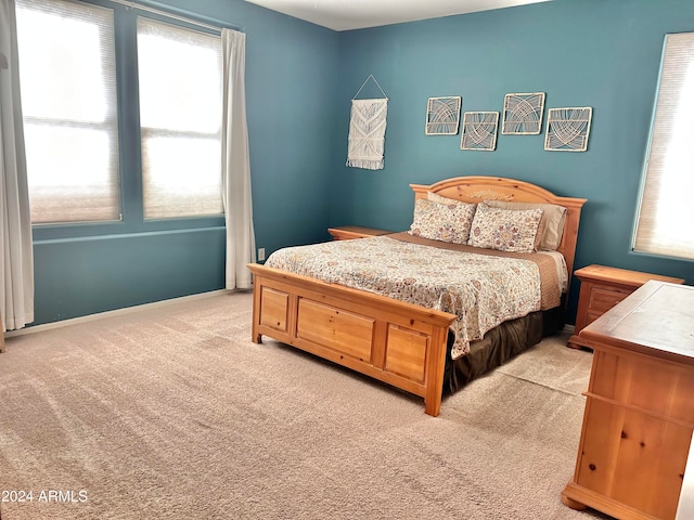 bedroom with light carpet