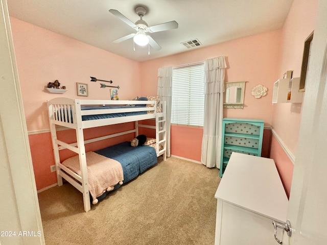 bedroom featuring light carpet and ceiling fan