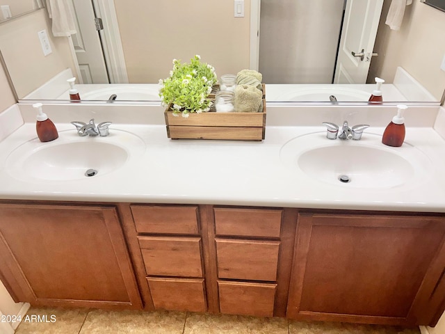 bathroom featuring vanity and tile patterned flooring