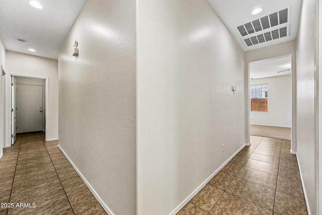 corridor featuring tile patterned flooring