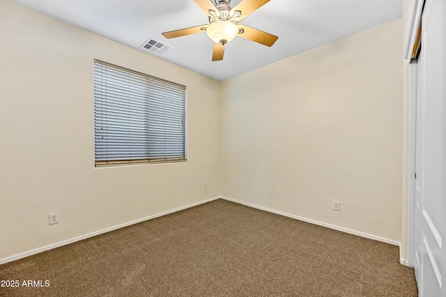 carpeted empty room with ceiling fan