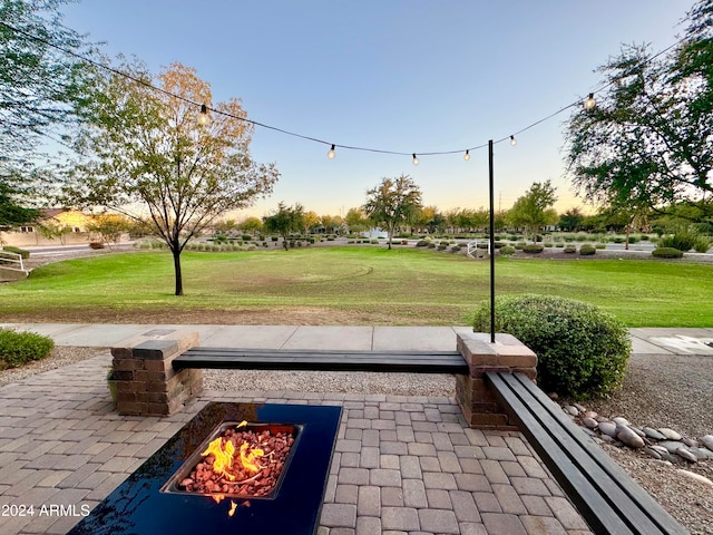 surrounding community with a yard and a patio