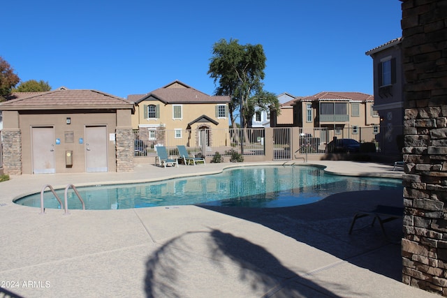 view of swimming pool with a patio area