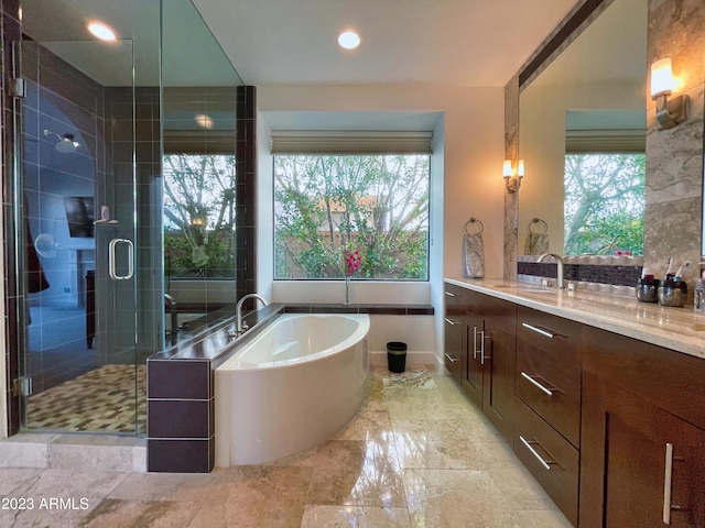 10068 E Turquoise Ave, Scottsdale, AZ 85258 - bathroom with a bath, a wealth of natural light, vanity, and a shower stall
