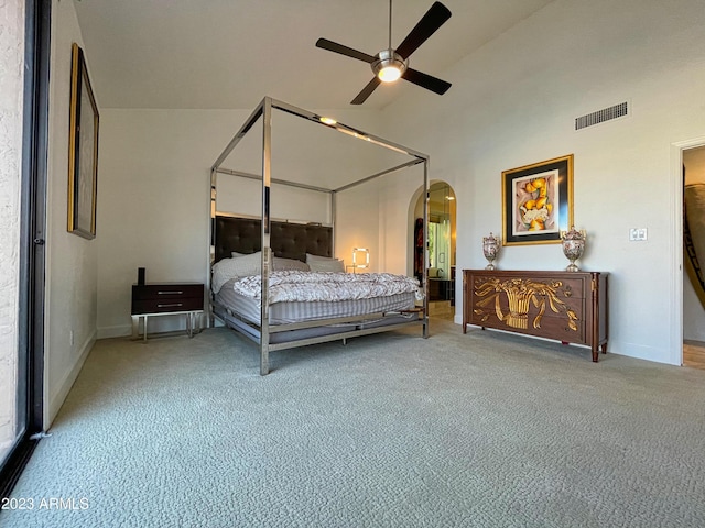 10068 E Turquoise Ave, Scottsdale, AZ 85258 - bedroom featuring carpet flooring, high vaulted ceiling, arched walkways, visible vents, and a ceiling fan