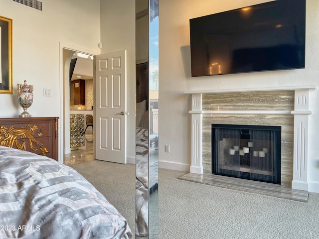 10068 E Turquoise Ave, Scottsdale, AZ 85258 - carpeted bedroom featuring baseboards, visible vents, and a premium fireplace