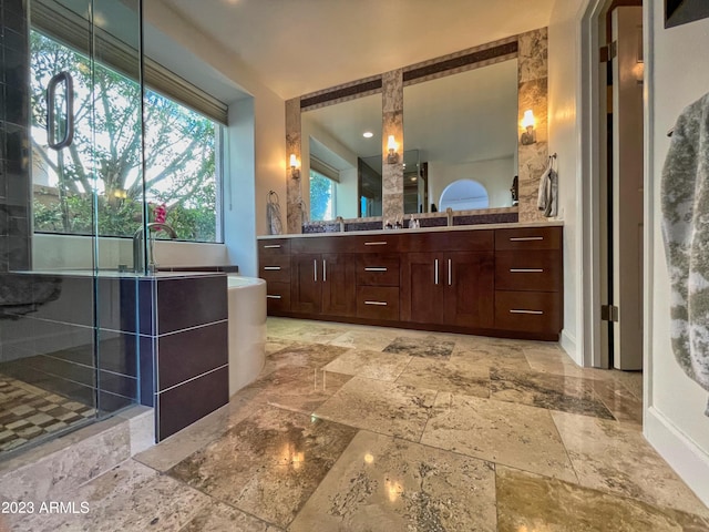 10068 E Turquoise Ave, Scottsdale, AZ 85258 - bathroom with stone finish floor, walk in shower, a soaking tub, and vanity