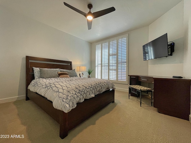 10068 E Turquoise Ave, Scottsdale, AZ 85258 - bedroom featuring light colored carpet, ceiling fan, and baseboards