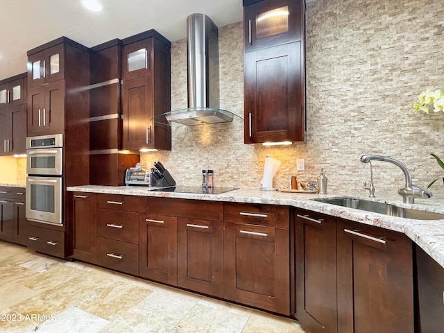 10068 E Turquoise Ave, Scottsdale, AZ 85258 - kitchen with a sink, wall chimney exhaust hood, tasteful backsplash, stainless steel double oven, and black electric cooktop