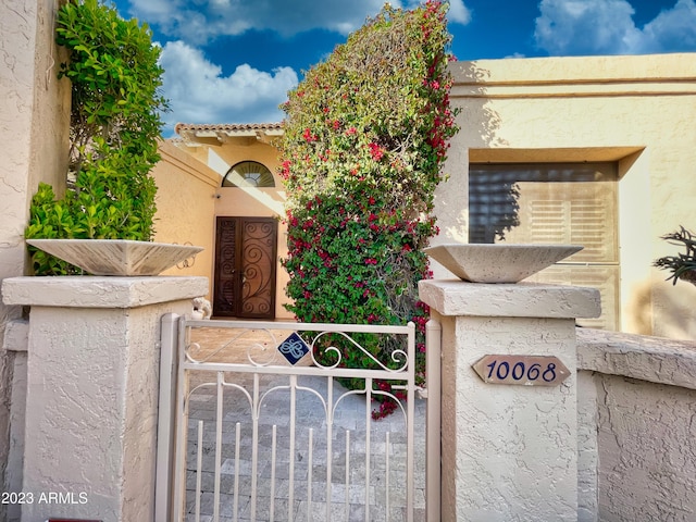 10068 E Turquoise Ave, Scottsdale, AZ 85258 - view of front of property featuring a gate and stucco siding