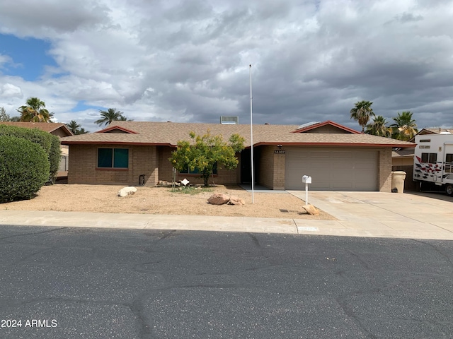 ranch-style house featuring a garage