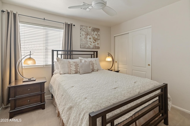 bedroom featuring carpet floors, baseboards, a closet, and ceiling fan