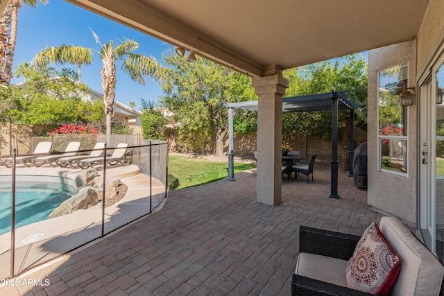 view of patio / terrace with a fenced backyard, a pergola, and a fenced in pool