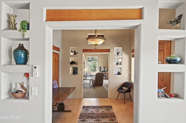 hall with wood finished floors
