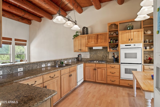kitchen with open shelves, white appliances, a sink, and light wood-style floors