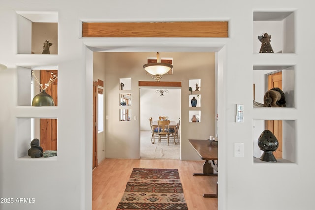 corridor with wood finished floors