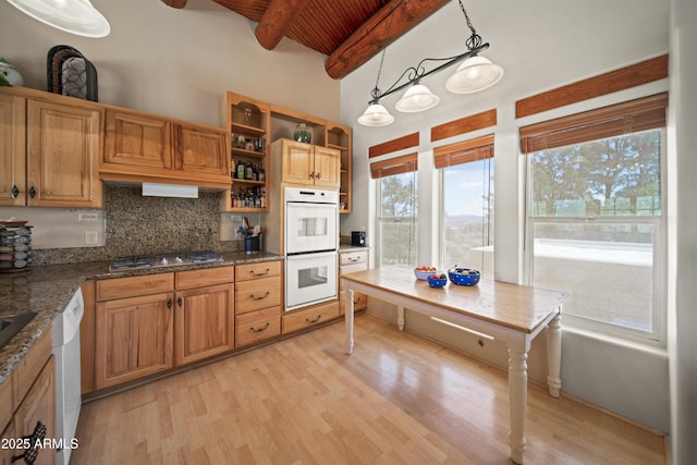 kitchen featuring open shelves, decorative backsplash, white appliances, light wood-type flooring, and beamed ceiling