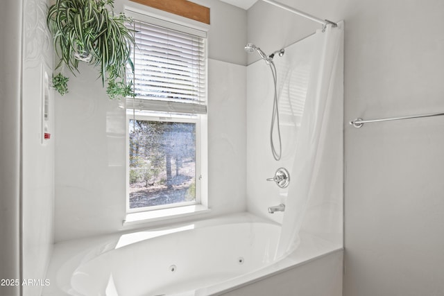 bathroom featuring a combined bath / shower with jetted tub and a healthy amount of sunlight