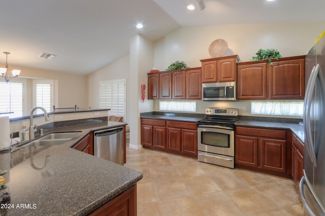 kitchen featuring high vaulted ceiling, a chandelier, decorative light fixtures, stainless steel appliances, and sink