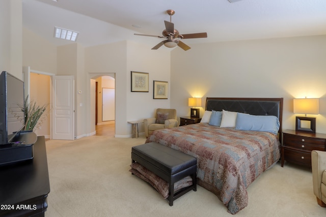 bedroom featuring high vaulted ceiling, light colored carpet, and ceiling fan