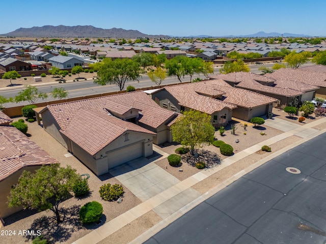 birds eye view of property with a mountain view