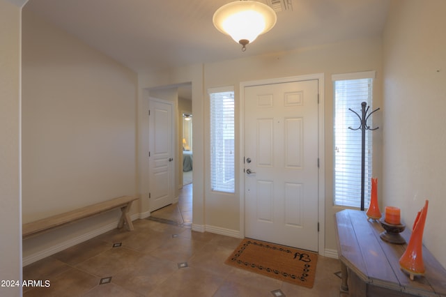 tiled entryway featuring plenty of natural light