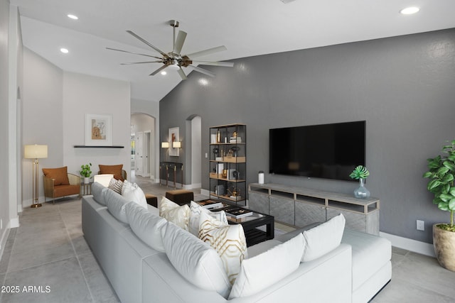 tiled living room featuring ceiling fan and high vaulted ceiling