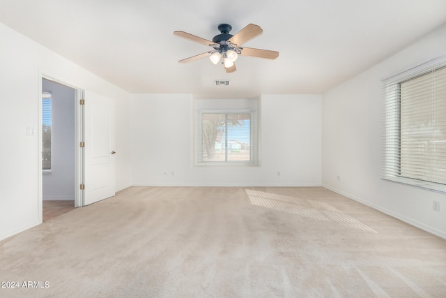 carpeted empty room with ceiling fan