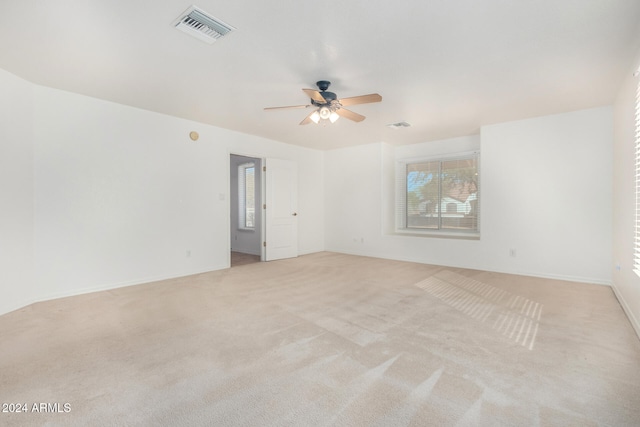 empty room with light carpet and ceiling fan