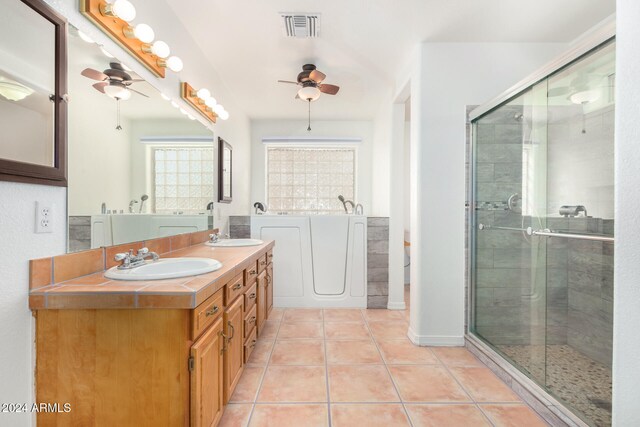 bathroom with tile patterned flooring, shower with separate bathtub, vanity, and ceiling fan