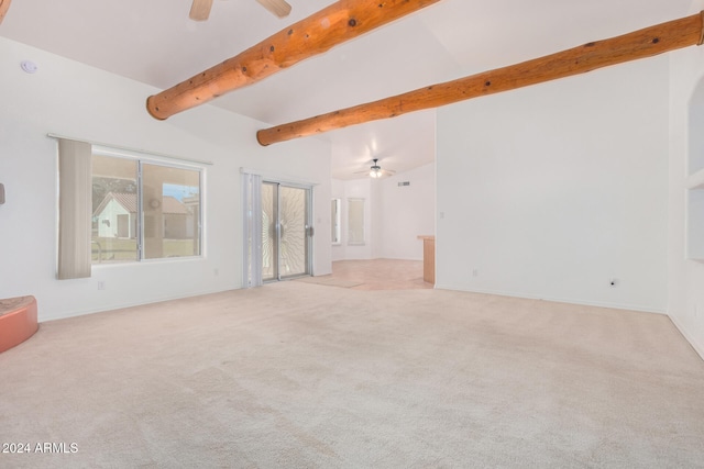 carpeted empty room with vaulted ceiling with beams and ceiling fan